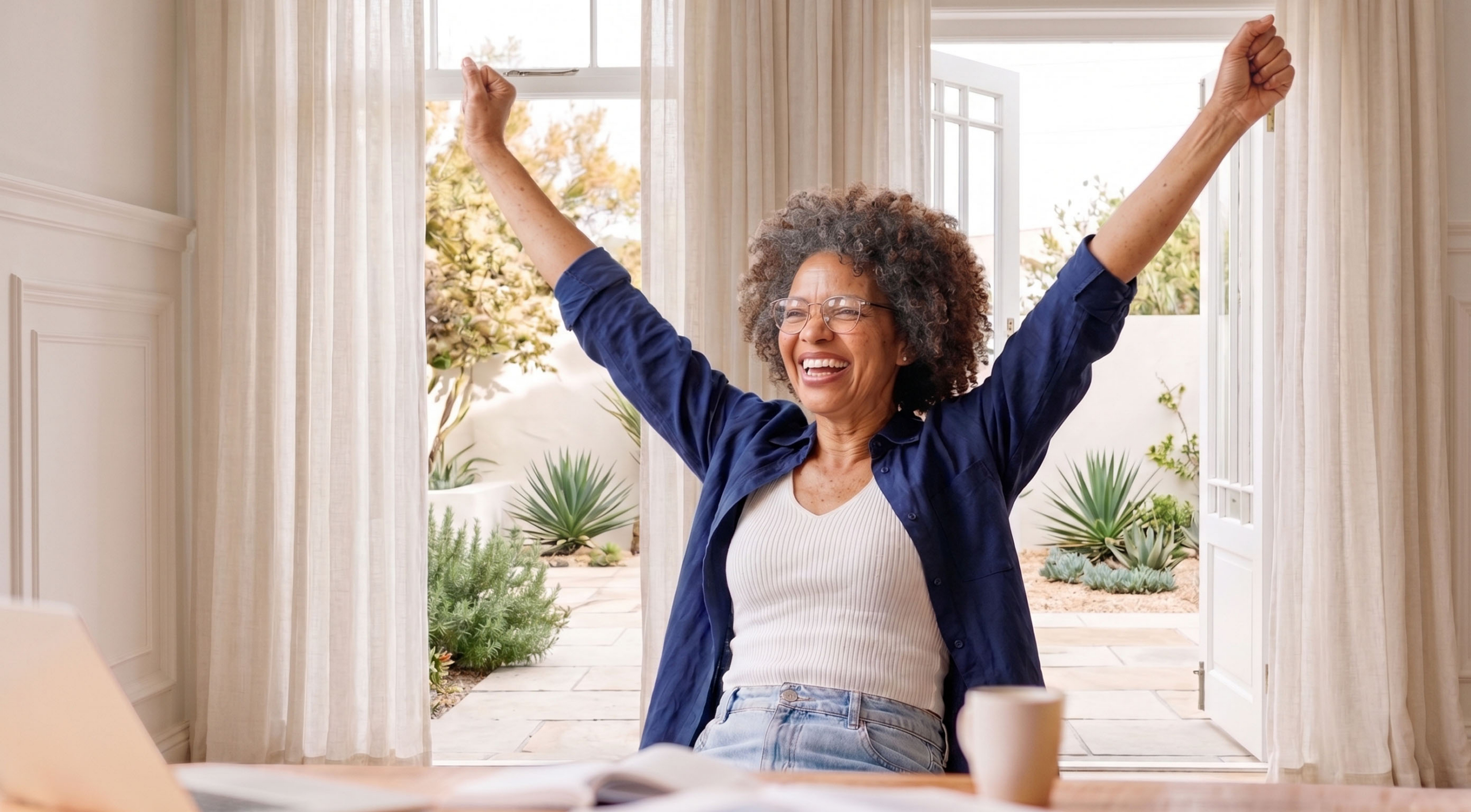 woman sitting cheering because she lost weight